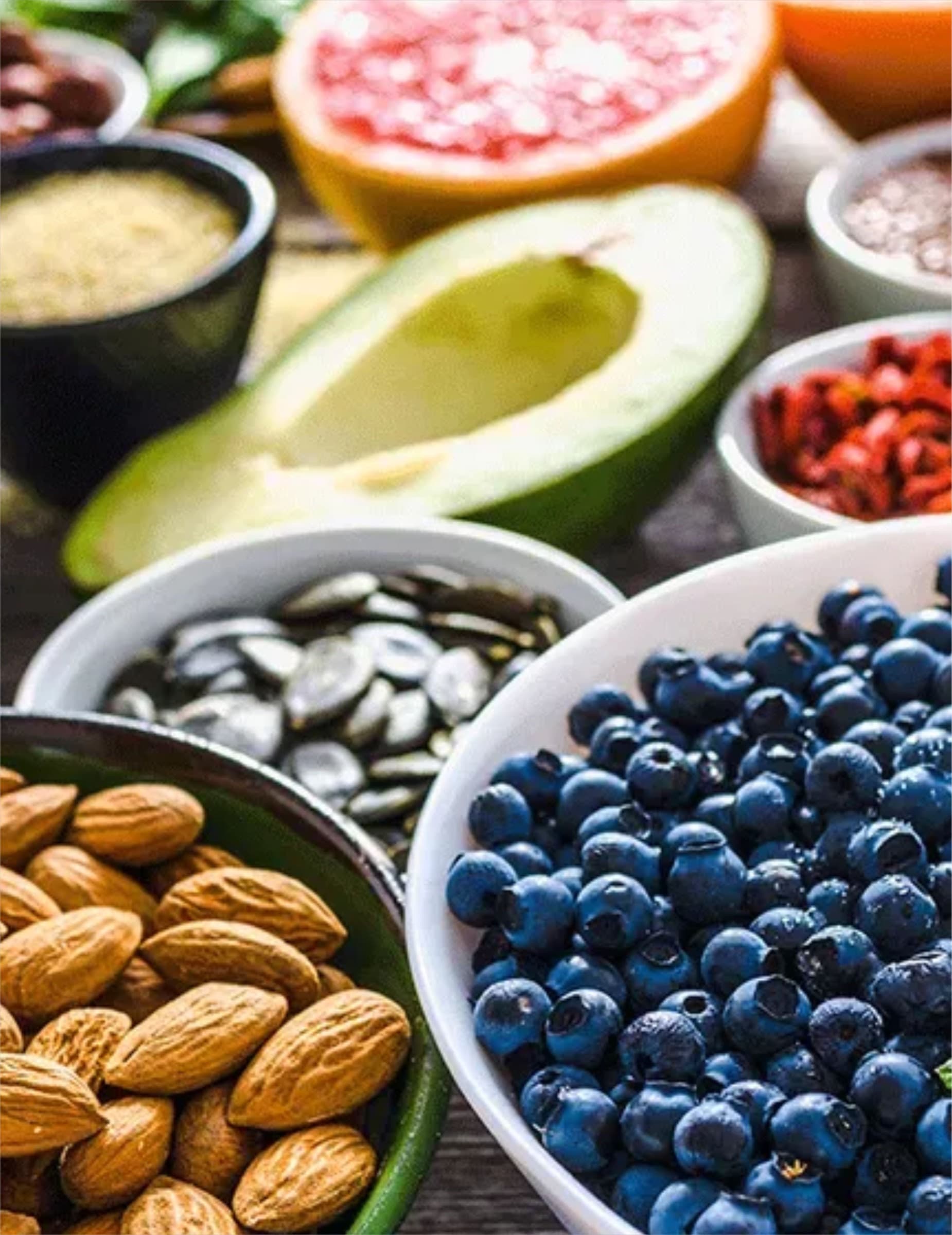 Bowls of fruit, nuts, and vegetables