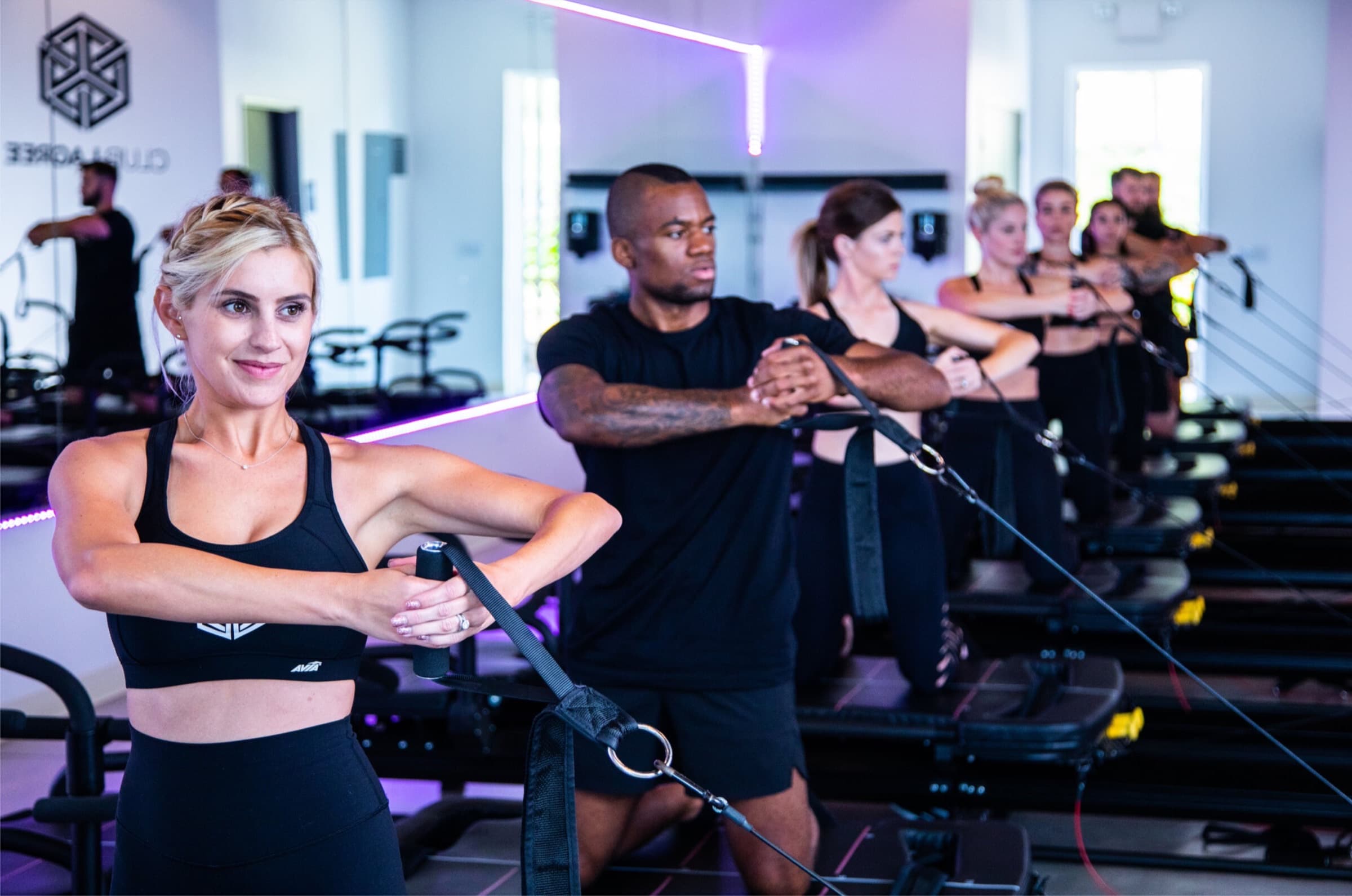 Club Lagree instructor guiding a studio workout