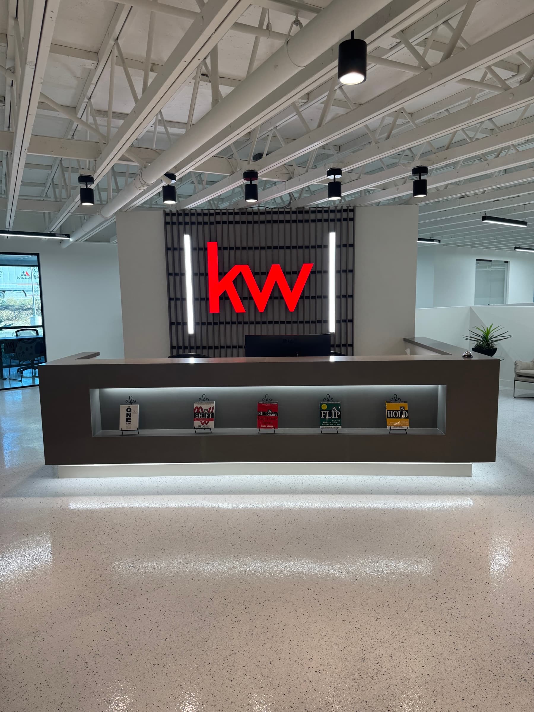 Keller Williams Westlake reception desk and wall logo