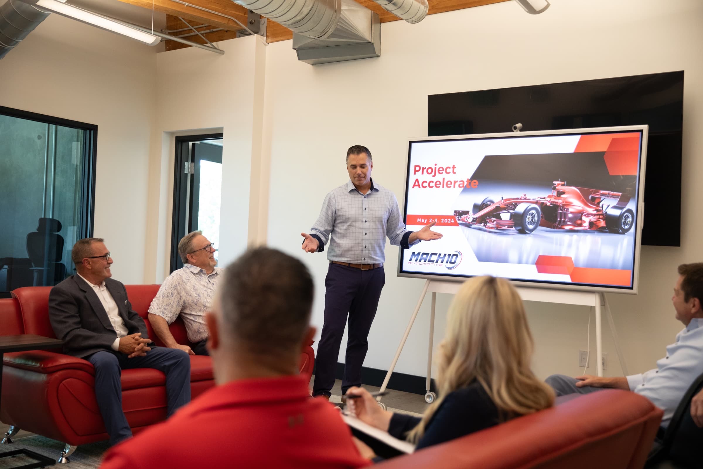 Mach 10 Automotive presentation in a conference room
