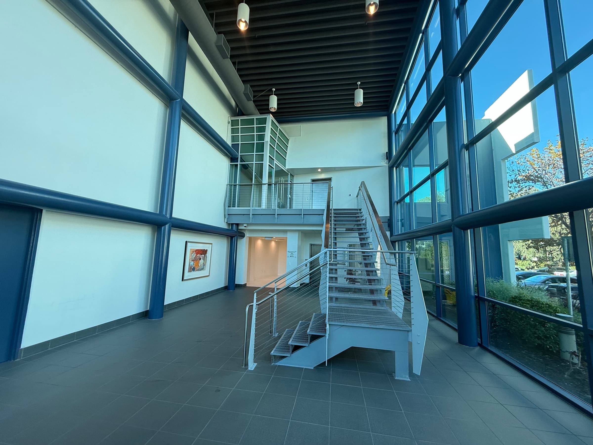 Atrium at 2475 Townsgate with blue steel beams and glass walls
